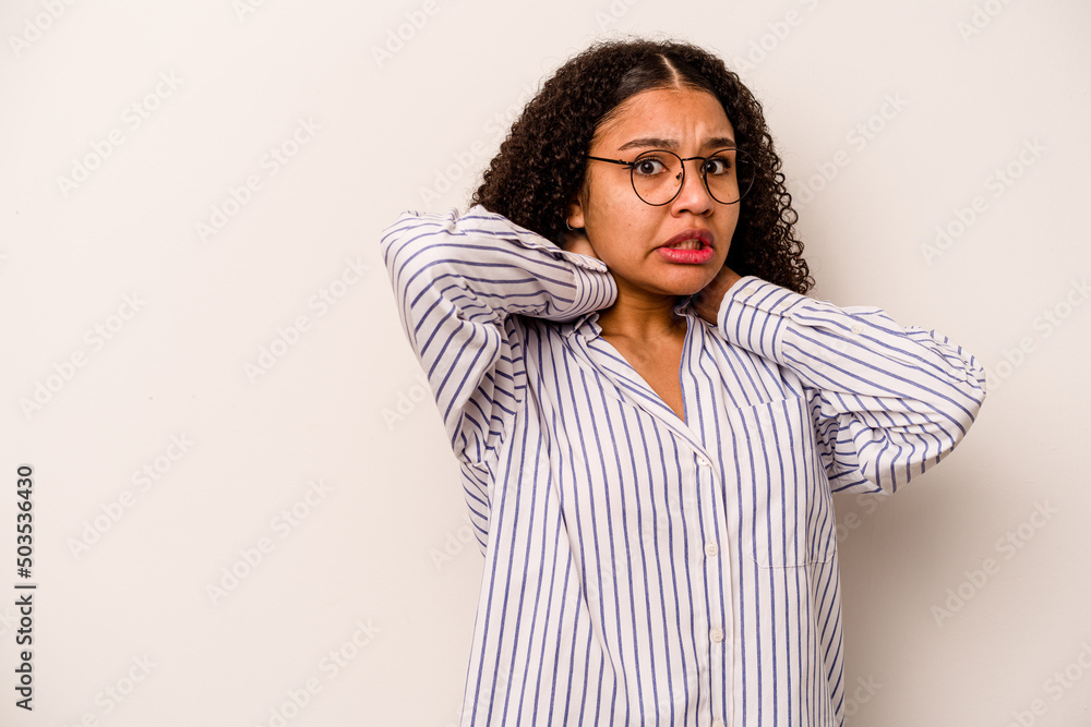 Young African American woman isolated on white background touching back of head, thinking and making a choice. Young African American woman isolated on white background touching back of head, thinking and making a choice.