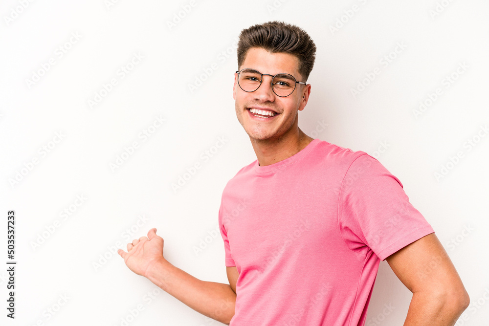 Young caucasian man isolated on white background showing a welcome expression. Young caucasian man isolated on white background showing a welcome expression.