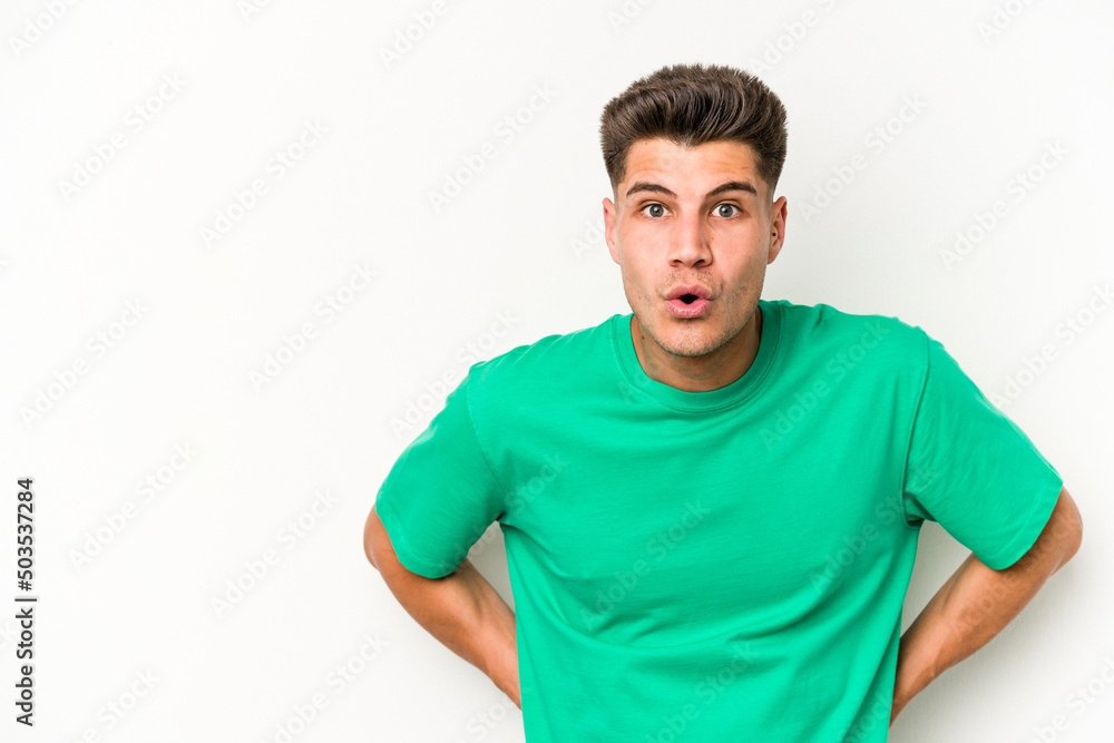 Obraz premium Young caucasian man isolated on white background being shocked because of something she has seen.