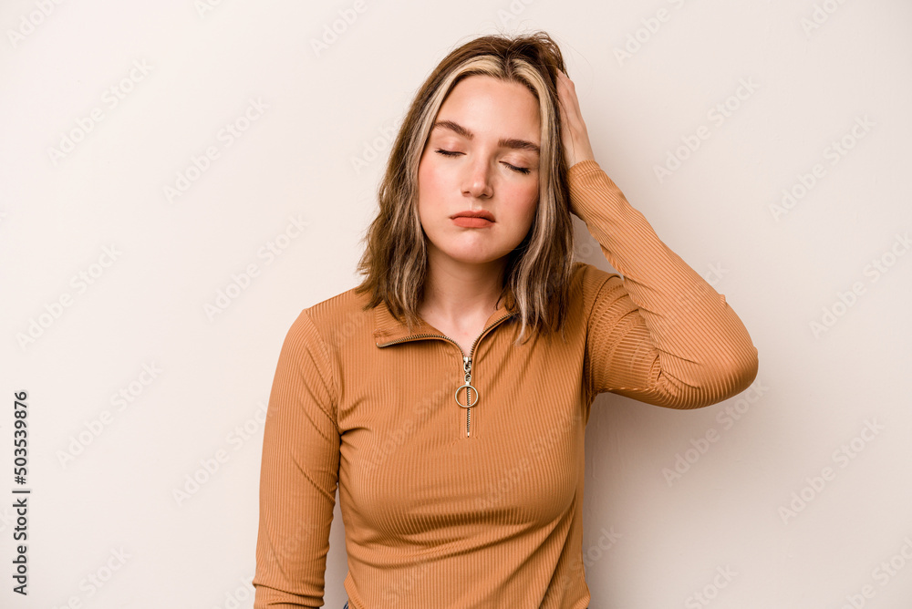 Young caucasian woman isolated on white background tired and very sleepy keeping hand on head. Young caucasian woman isolated on white background tired and very sleepy keeping hand on head.