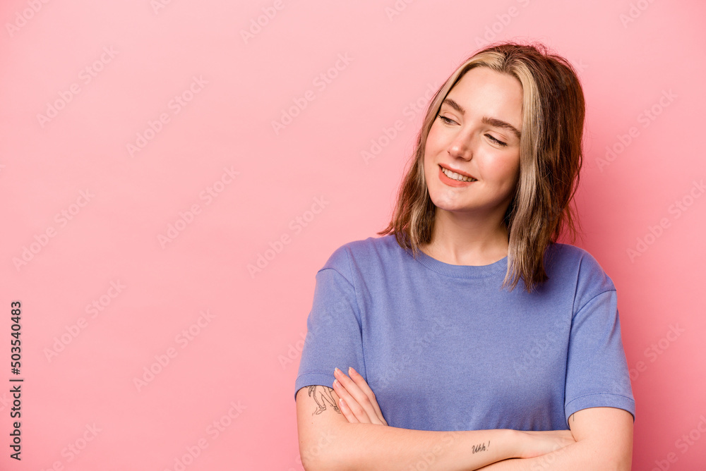 Young caucasian woman isolated on pink background smiling confident with crossed arms. Young caucasian woman isolated on pink background smiling confident with crossed arms.