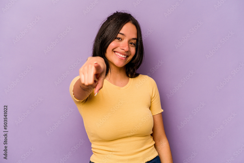 Young hispanic woman isolated on purple background cheerful smiles pointing to front. Young hispanic woman isolated on purple background cheerful smiles pointing to front.
