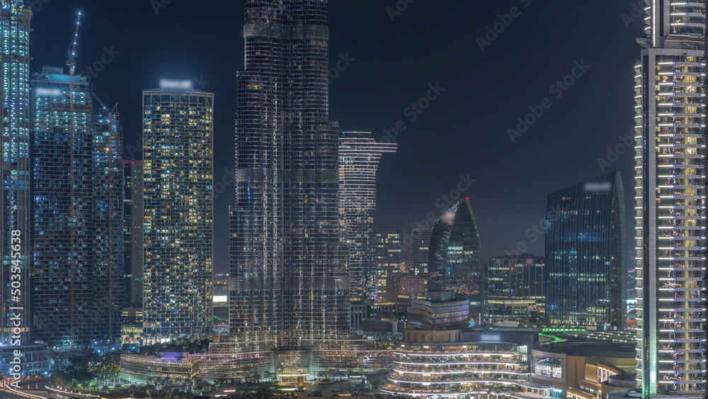 Futuristic aerial night cityscape timelapse with illuminated architecture of Dubai downtown, United Arab Emirates. Futuristic aerial night cityscape timelapse with illuminated architecture of Dubai downtown, United Arab Emirates.