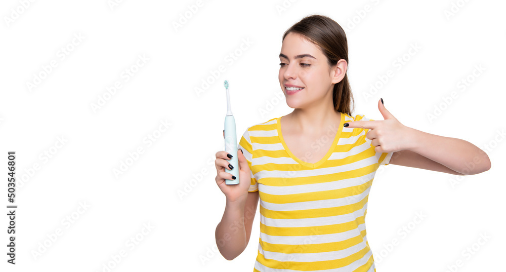 smiling young woman point finger on electric toothbrush isolated on white background smiling young woman point finger on electric toothbrush isolated on white background
