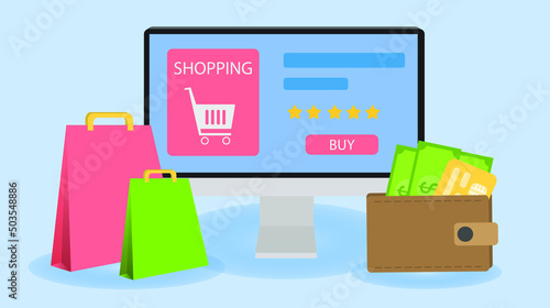 Online shopping on a computer has paper bags and purses with green money and yellow credits in front.