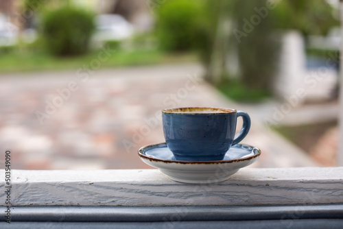 cup coffee in table blurred background