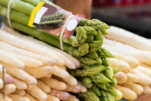 Close up of green and white asparagus at weekly market
