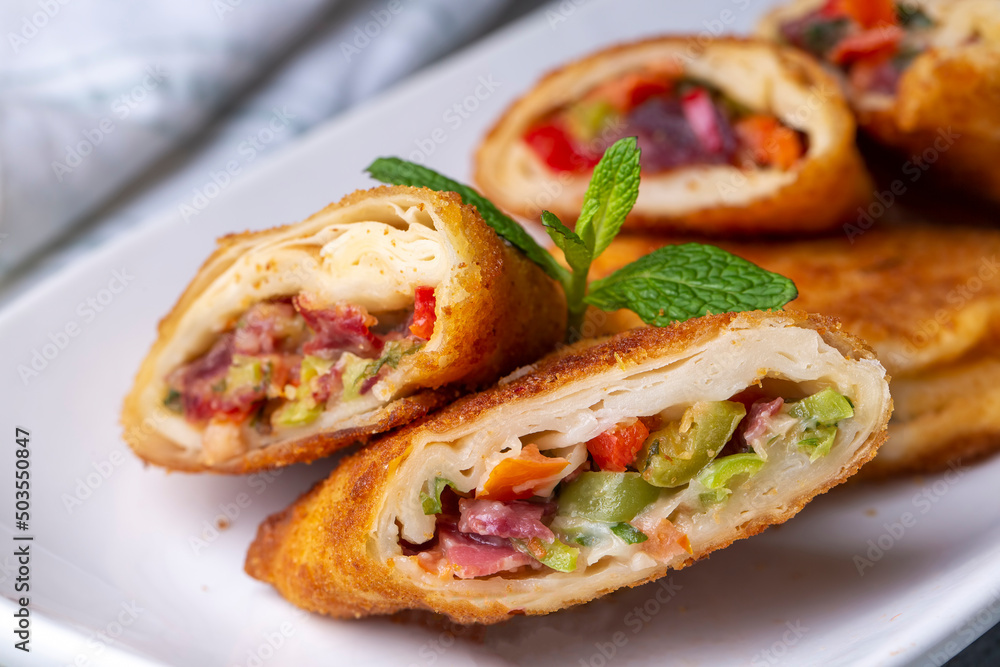 Turkish Pacanga Boregi with pastirma (pastrami) and cheddar (melted) cheese. - Pastirmali Borek Turkish Pacanga Boregi with pastirma (pastrami) and cheddar (melted) cheese. - Pastirmali Borek