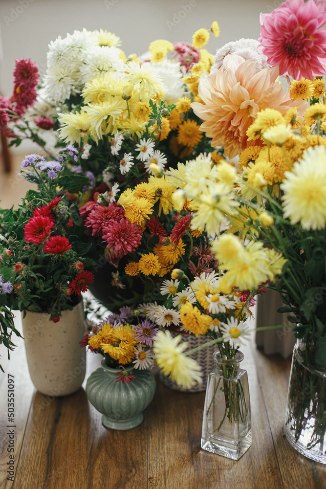 Beautiful autumn flowers on rustic background. Hello autumn! Stylish fall bouquets with yellow and pink asters and dahlias. Happy Thanksgiving! Floral wallpaper, Moody image