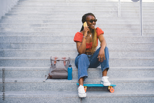 young black woman calling from her smartphone during her vacations 
