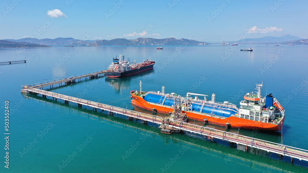 Aerial drone top view photo of industrial LNG gas container tanker anchored in Mediterranean port
