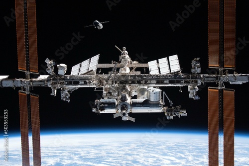 Fototapeta Naklejka Na Ścianę i Meble -  International Space Station in orbit. Docking of the Russian spacecraft. Elements of this image furnished by NASA.