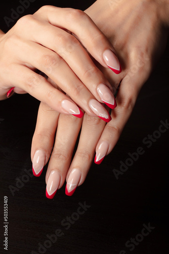 nail manicure and beautiful lady's hand photo