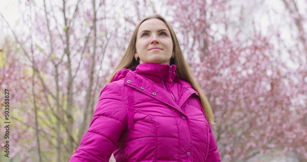 Calm beautiful smiling young woman enjoying the fresh air in the park outdoors, relaxing , feeling alive, breathing, dreaming Calm beautiful smiling young woman enjoying the fresh air in the park outdoors, relaxing , feeling alive, breathing, dreaming