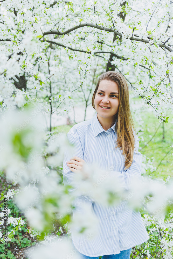 Portrait of beautiful romantic lady in apple trees blossoms Portrait of beautiful romantic lady in apple trees blossoms