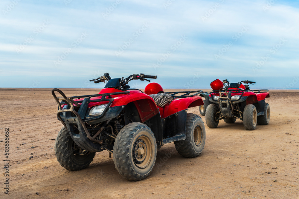 Quad bike tour. Red quadricycles in the desert. Explore Egypt Quad bike tour. Red quadricycles in the desert. Explore Egypt