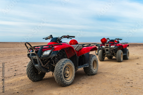 Quad bike tour. Red quadricycles in the desert. Explore Egypt