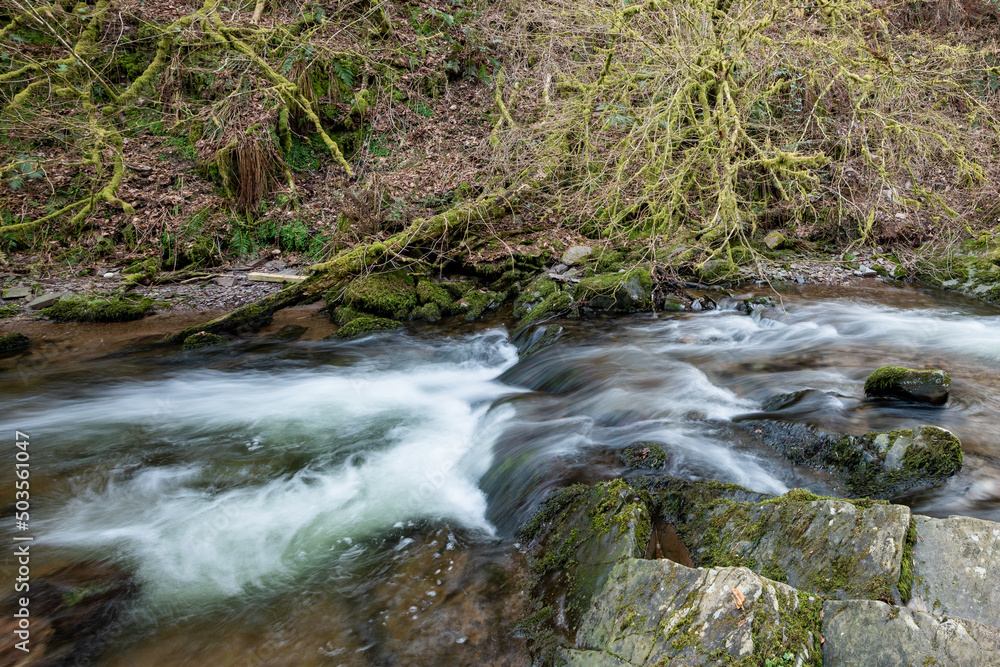 Long exposure of a waterfall on the river Horner in Horner woods in Somerset Long exposure of a waterfall on the river Horner in Horner woods in Somerset