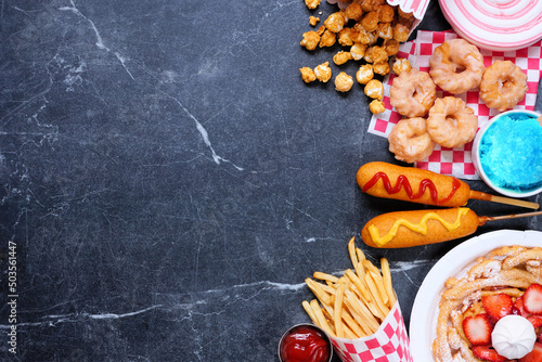 Fotografie Carnival theme food side border on a dark background