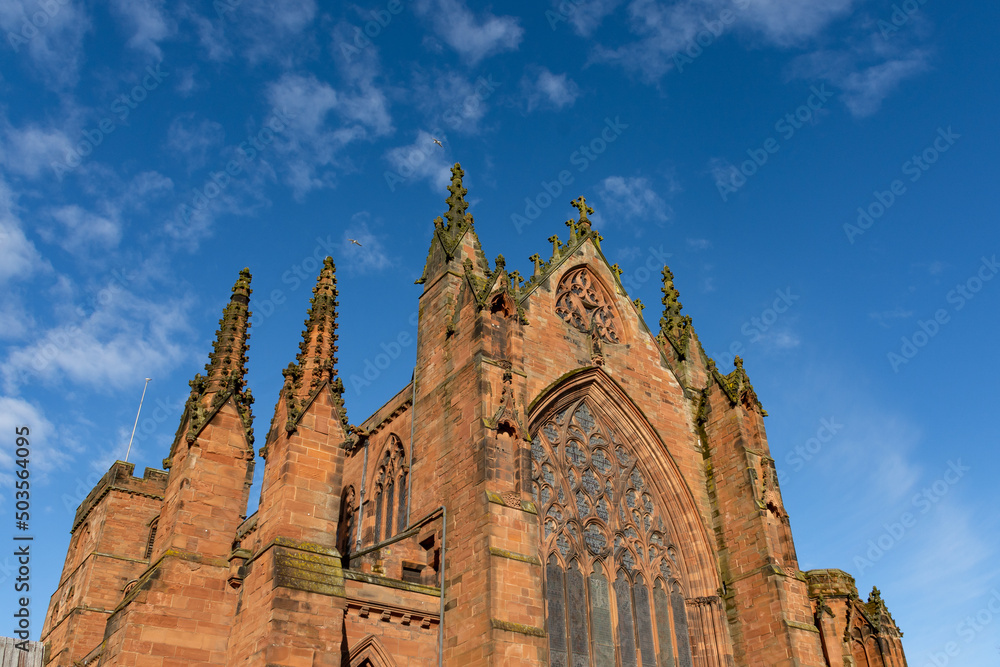 Carlisle Cathedral in the spring sunshine.  The second smallest of England's ancient cathedrals it was founded as an Augustinian priory and became a cathedral in 1133.  Carlisle, Cumbria, UK.