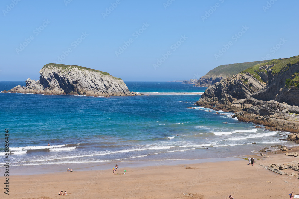 An extensive beach with transparent waters and surrounded by vegetation. An extensive beach with transparent waters and surrounded by vegetation.