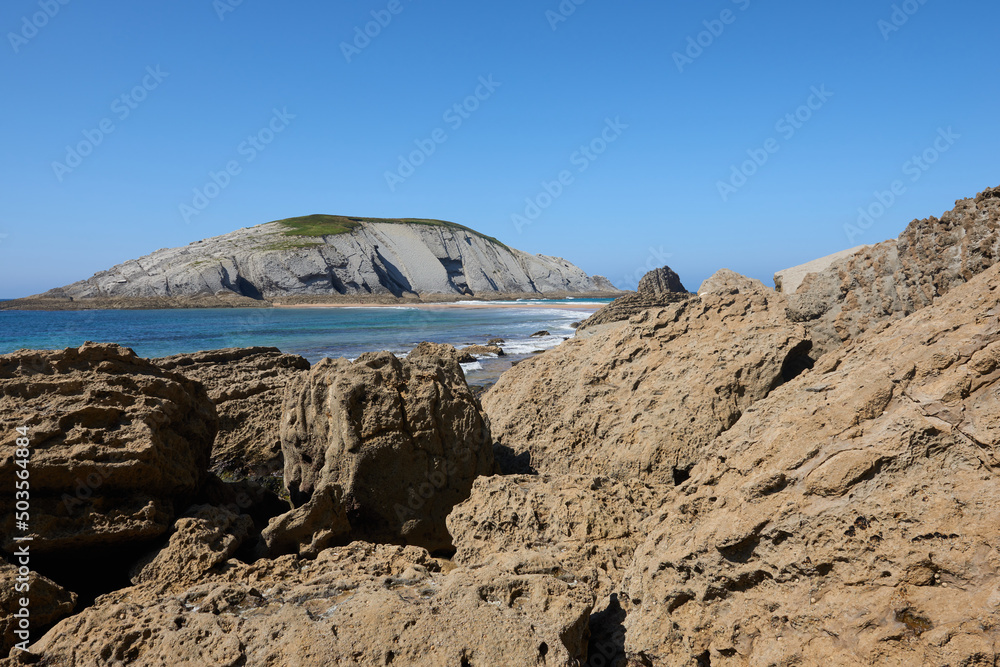 Cliffs next to a turquoise blue sea