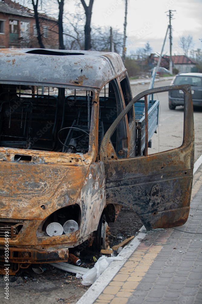 Burnt car after shelling by Russian military