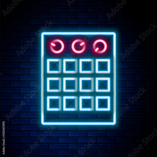 Glowing neon line Drum machine icon isolated on brick wall background. Musical equipment. Colorful outline concept. Vector
