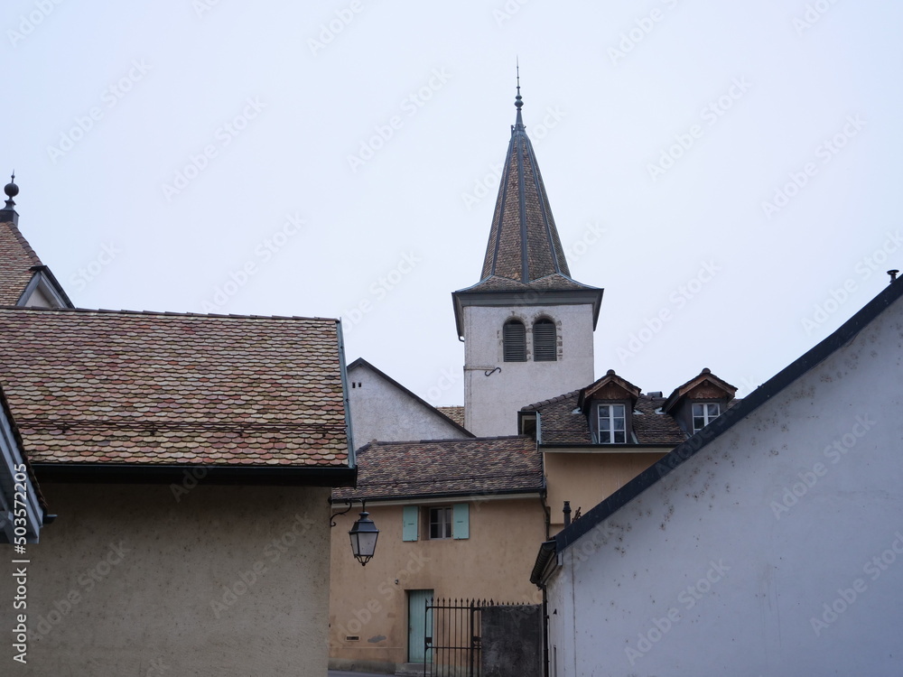 The spire of the church of Perroy. Switzerland.