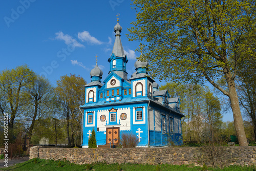 Old ancient wooden church of the Holy Life Giving Trinity. Telyadovichi village, Kopyl district, Minsk region, Belarus. photo