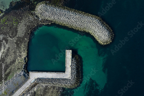 Aerial view on a small pier for a ferry or small boat. Nobody. Inishmaan, Aran Island, county Galway, Ireland. photo