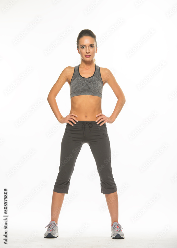 athletic girl in training clothes posing on a white background in the studio in full growth
athletic girl in training clothes posing on a white background in the studio in full growth