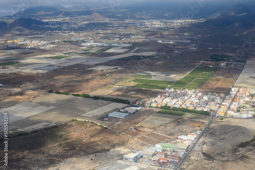 Aerial panoramic view on south part of Tenerife island, agricultural and volcatic landscape, Canary islands, Spain photo