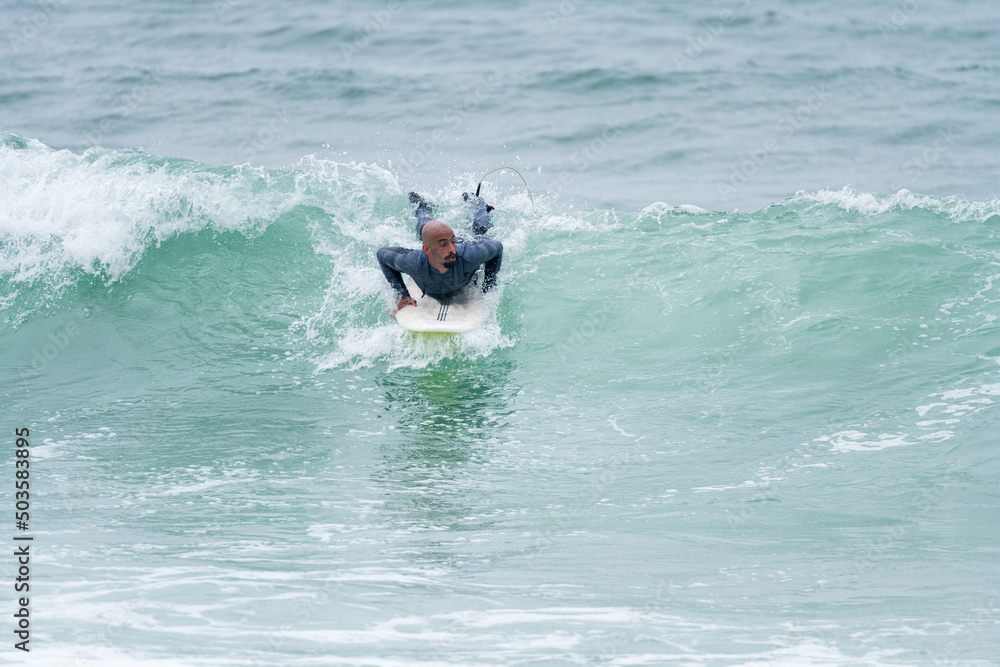 Surfer riding waves Surfer riding waves