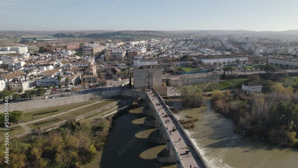 Aerial view of historic center of Cordoba with ancient Roman Bridge over Guadalquivir river in Spain Aerial view of historic center of Cordoba with ancient Roman Bridge over Guadalquivir river in Spain