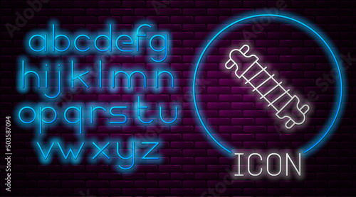 Glowing neon line Bicycle suspension icon isolated on brick wall background. Neon light alphabet. Vector