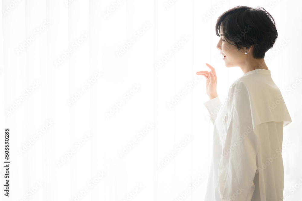 Beautiful woman in profile staring into the distance White background Beautiful woman in profile staring into the distance White background