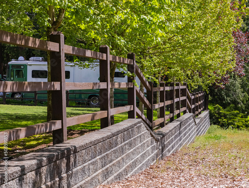 Modern Fence Made From Natural Wood Board. Backyard of the luxury house with wooden fence. photo