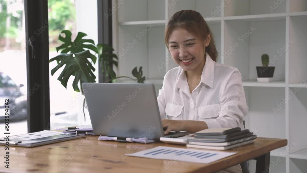 Beautiful Asian woman using a laptop computer Beautiful Asian woman using a laptop computer