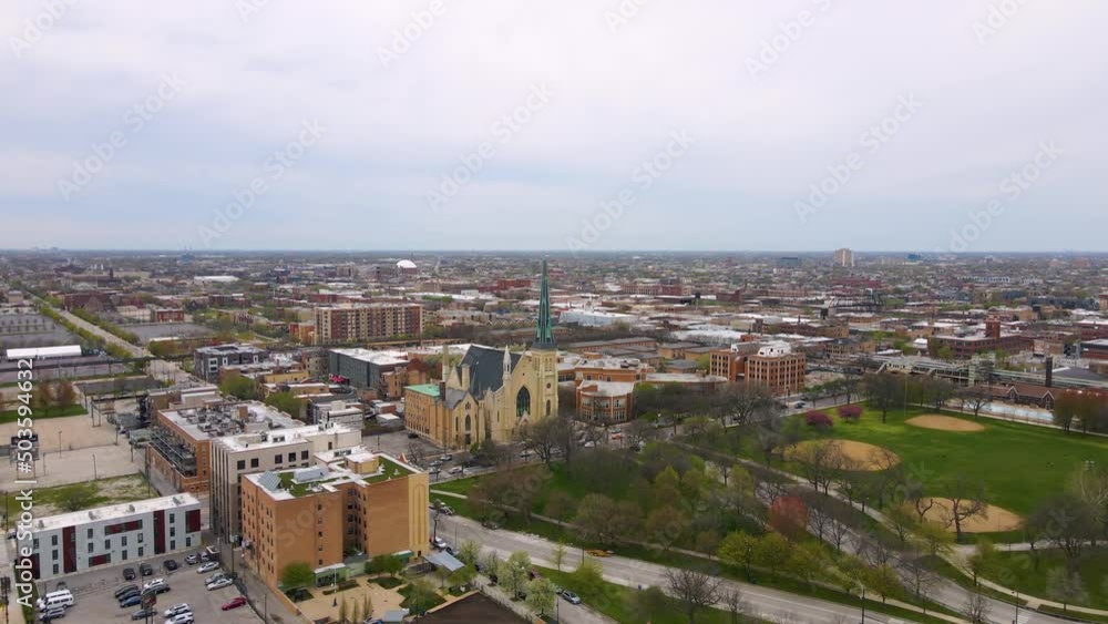 aerial drone shot of Chicago urban city area. the aerial photography of the city is beautiful with skyscrapers and clouds aerial drone shot of Chicago urban city area. the aerial photography of the city is beautiful with skyscrapers and clouds