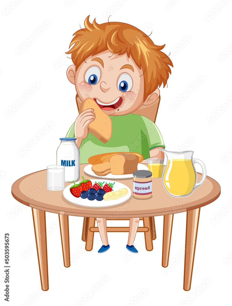 Happy boy having meal at the table Happy boy having meal at the table