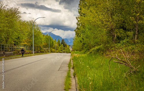 Rural Roads.Rural Village Landscape. Countryside road in overcast day in Canada photo