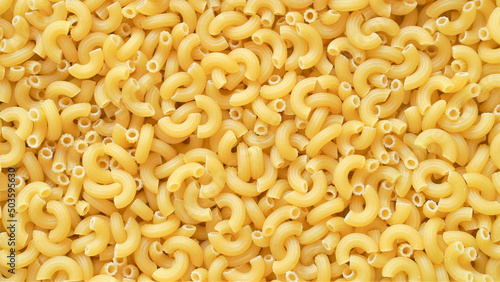 Uncooked elbow macaroni pasta background