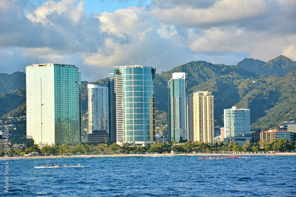 Honolulu and Waikiki city skyline view with mountains in the background and ocean in the foreground on Oahu, Hawaii Honolulu and Waikiki city skyline view with mountains in the background and ocean in the foreground on Oahu, Hawaii