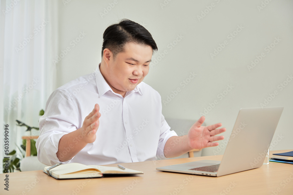A moment of business man work at home with laptop in living room A moment of business man work at home with laptop in living room