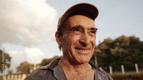 Portrait of Latin man in the farm on sky background.