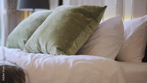 house interior design detail of Pillow on bed decoration in bedroom interior dolly shot with big white curtian light through window background photo