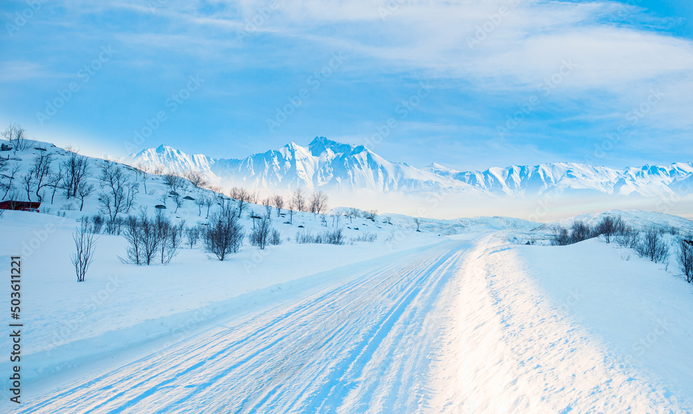 Obraz premium Beautiful winter landscape with snow and ice covered road - Tromso, Norway - Arctic landscape