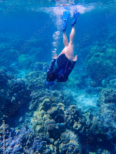 person snorkeling in the sea in bora bora