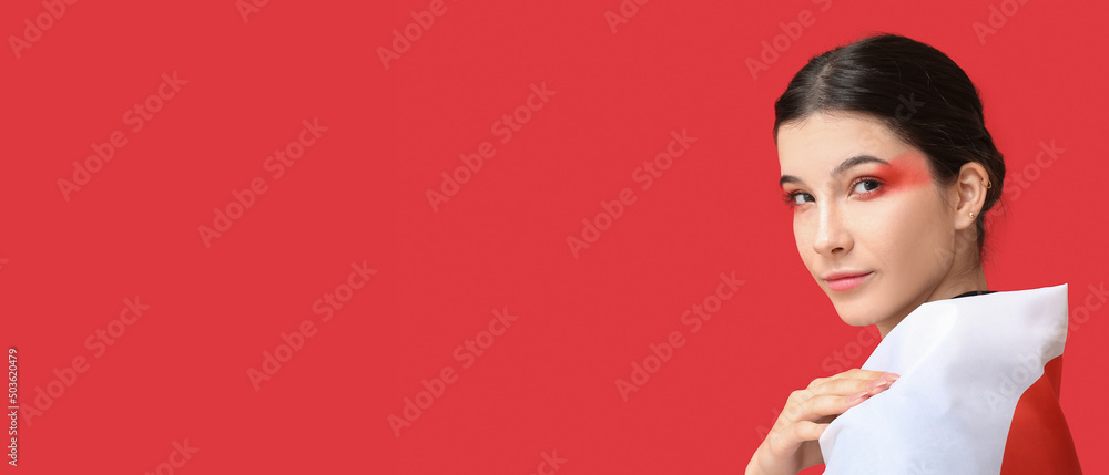 Beautiful young woman with flag of Japan on red background with space for text Beautiful young woman with flag of Japan on red background with space for text
